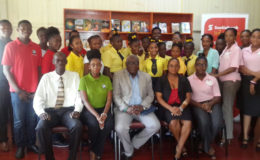 Students of the Freeburg Secondary School stand along with representatives of Nulli Secundus, Scotia Bank and the Ministry of Education, following the handing over ceremony of their newly refurbished library on Friday. Seated from left are: Pastor Wilbert Lee, Coordinator of Nulli Secundus; Tiffany David, President (ag) of Nulli Secundus; Chief Education Officer (ag) Marcel Hutson; Headmistress of Freeburg Secondary Bonita Collins and a representative of Scotia Bank’s Credit Risk Department.