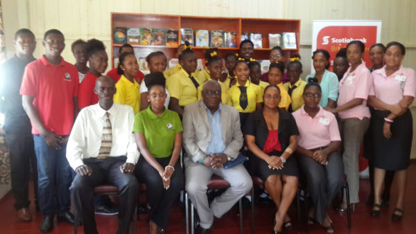 Students of the Freeburg Secondary School stand along with representatives of Nulli Secundus, Scotia Bank and the Ministry of Education, following the handing over ceremony of their newly refurbished library on Friday. Seated from left are: Pastor Wilbert Lee, Coordinator of Nulli Secundus; Tiffany David, President (ag) of Nulli Secundus; Chief Education Officer (ag) Marcel Hutson; Headmistress of Freeburg Secondary Bonita Collins and a representative of Scotia Bank’s Credit Risk Department.