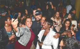 Fans take photos with T&T soca star Machel Montano after he arrived at the Scotiabank Theatre in Canada, where he joined fans for a showing of Bazodee on Tuesday night. Montano was the headline act at the We Day Benefit concert on Wednesday night.