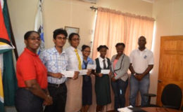 Essay competition winners with Chief Port Security Officer Dwain Nurse (right) and Director of Ports, Louise Williams (left). (GINA photo)