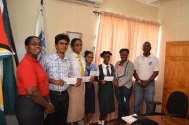 Essay competition winners with Chief Port Security Officer Dwain Nurse (right) and Director of Ports, Louise Williams (left). (GINA photo)