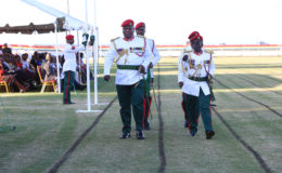 Old Army Chief of Staff Brigadier Mark A Phillips (left) and his replacement Brigadier George A Lewis (right) marching during the Change of Command Parade at Camp Ayanganna yesterday. (Photo by Keno George)