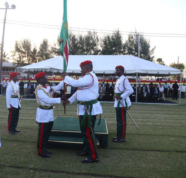 Chief of Staff of the Guyana Defence Force Brigadier George A Lewis (second, left) is symbolically handed the command of the army by his predecessor Brigadier Mark A Phillips (second, right) at the Change of Command Parade at Camp Ayanganna yesterday. (Photo by Keno George)