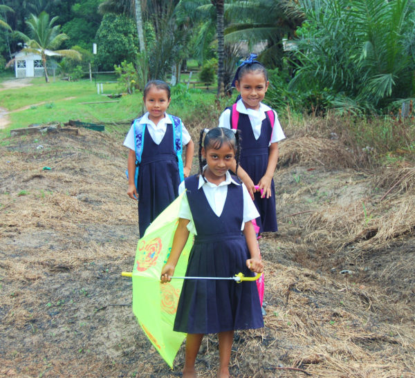 Schoolgirls on their way home on Friday at Rockstone in Region 10 (Upper Demerara/Upper Berbice) (Photo by Mariah Lall)