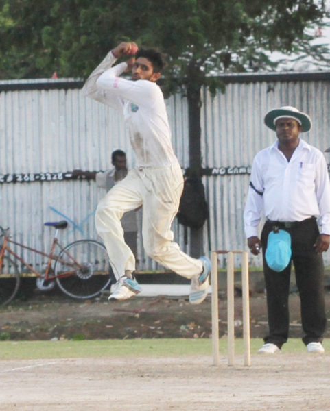 Lower Corentyne’s Sharaz Ramcharran shows perfect form on his way to capturing a five-wicket haul yesterday at the Tuschen ground. He ended with 5-53 but his effort was not enough to see his team capture first innings points against West Demerara. (Orlando Charles photo)