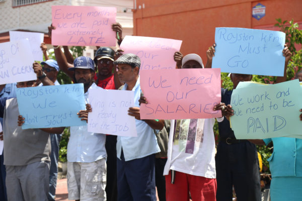 Some of the City Council workers yesterday protesting outside the Ministry of Communities in Kingston over the delayed payment of their salaries. (Photo by Keno George)