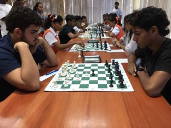 Roberto Neto, left and Aravinda Singh during their first round match yesterday. 