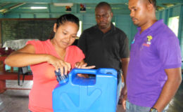A demonstration of the use of the water filter (GWI photo)
