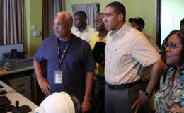 Jamaica's Prime Minister Andrew Holness meets with Michael Saunderson, Operations Manager of the National Works Agency, as Jamaicans brace on Saturday for the arrival of Hurricane Matthew in Kingston, Jamaica, October 1, 2016. REUTERS/Gilbert Bellamy 