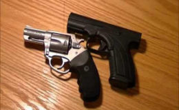 The .38 revolver and 9mm pistol that were found on the man. 