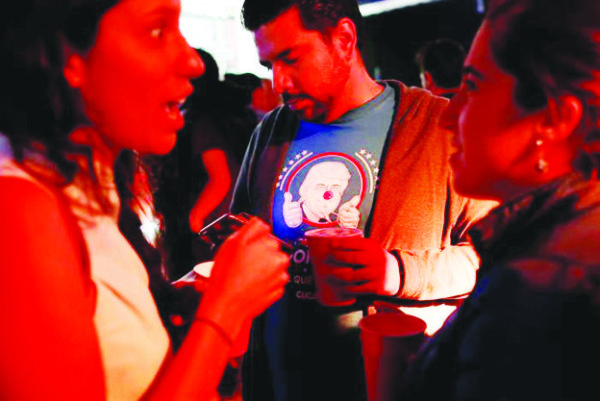 A reveler wearing a t-shirt with an image of Republican presidential nominee Donald Trump attends a Mexican brewery booze-up in Mexico City, Mexico October 20, 2016. REUTERS/Carlos Jasso 