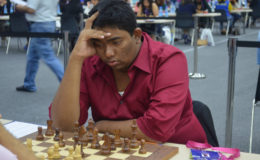 Taffin Khan contesting one of his games for Guyana at the 42nd Chess Olympiad in Baku, Azerbaijan. Khan was the most successful player for the men’s chess team at the Olympiad. He contested ten games, at times playing Board One for his country, and scored victories against Guernsey, Malta, Bermuda and Macau. He drew with Fiji, Guatemala, San Marino and Lesotho and lost to Macedonia and Ghana. Khan’s six points was the highest score from the men’s team.