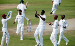 The West Indies team celebrates the dismissal of Younis Khan. (Photo courtesy of WICB website) 