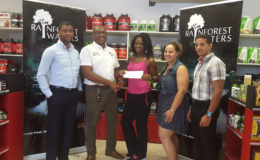 Banks DIH’s Clive Pellew (second left) presents his company’s sponsorship package to Noshavyah King, in the presence of (from left) Errol Nelson, Jordana Ramsey-Gonsalves and Jamie McDonald.
