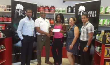 Banks DIH’s Clive Pellew (second left) presents his company’s sponsorship package to Noshavyah King, in the presence of (from left) Errol Nelson, Jordana Ramsey-Gonsalves and Jamie McDonald. 