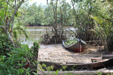 Two abandoned boats rest in a tiny peaceful cove at Kumaka. (Photo by Joanna Dhanraj) 