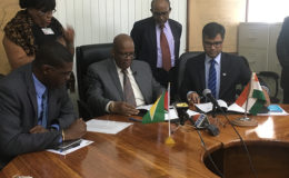 Minister of Finance Winston Jordan (third from left) and Resident Representative from Exim Bank Sailesh Prashad (right) signing the agreement with Minister of Public Infrastructure, David Patterson (left) and High Commissioner of India to Guyana Venkatachalam Mahalingam (second from right) looking on in the Ministry of Finance Boardroom.
