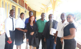 Guyana Teachers’ Union executive members with their lawyer outside the court after the decision was read. From left are Regional Vice President for Demerara Collis Nicholson, Sumanta Alleyne, Julian Cambridge, Stacy Benjamin, Lancelot Baptiste, attorney Roysdale Forde, GTU President Mark Lyte and General Secretary Coretta McDonald.
