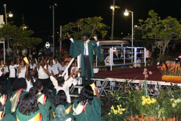 Despite the colour of his hair, Valedictorian Kibwey Peterkin was anything but blue as he left the stage to loud applause from his family and classmates last evening after receiving the President’s Award at the University of Guyana’s 50th Convocation Ceremony. See story on page 16 (Photo by Keno George) 