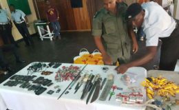 Joint Services members going through the contraband seized yesterday morning at the Georgetown Prison. (Ministry of the Presidency photo)
