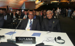 President David Granger (right) with Finance Minister Winston Jordan at the conference. (Ministry of the Presidency photo)
