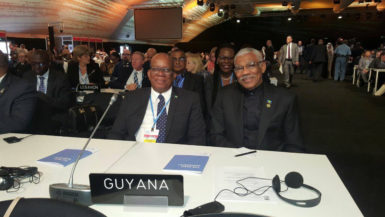 President David Granger (right) with Finance Minister Winston Jordan at the conference. (Ministry of the Presidency photo) 
