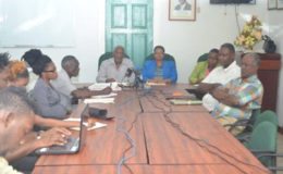 Minister of Social Protection Volda Lawrence and Minister within the Ministry, Keith Scott, along with staff of the Ministry and representatives of Guyana Bauxite and General Workers Union (GINA photo)