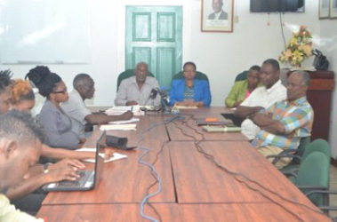 Minister of Social Protection Volda Lawrence and Minister within the Ministry, Keith Scott, along with staff of the Ministry and representatives of Guyana Bauxite and General Workers Union (GINA photo)