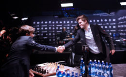 Sergey Karjakin, the challenger (left) shakes the hand of Magnus Carlsen, the defending world champion, before the start of yesterday’s fifth game of their World Chess Championship title match, in Manhattan, New York. (Photo courtesy of FIDE.com) (See page 29)