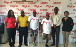 Digicel’s Senior Sponsorship & Events Executive, Louanna Abrams (left) pose for a photo with head of the Special Olympics committee Wilton Spenser, some of the athletes for the event and Assistant Director of Sports Bryan Smith. To the extreme right is Digicel’s Communications Manager, Vidya Bijlall-Sanichara.
