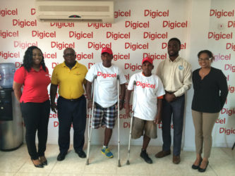 Digicel’s Senior Sponsorship & Events Executive, Louanna Abrams (left) pose for a photo with head of the Special Olympics committee Wilton Spenser, some of the athletes for the event and Assistant Director of Sports Bryan Smith. To the extreme right is Digicel’s Communications Manager, Vidya Bijlall-Sanichara.