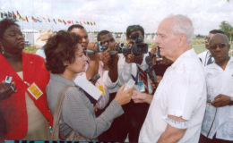 Late founder of Stabroek News David de Caires (right, foreground) speaks to local and foreign journalists outside the Caricom Secretariat, during a protest against the cutting off of ads to this newspaper at in October 2007.