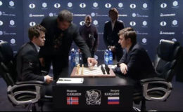 Astrophysicist Neil de Grasse Tyson makes the first move in game eight of the FIDE World Chess Championship between Magnus Carlsen and Serjey Karjakin (Photo courtesy of FIDE.com)
