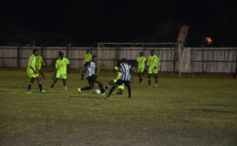 Ryan Hackett (3rd from right) of Santos successfully completes a tackle against a Botofago player in their U19 matchup in the Fruta Conquerors Academy League at the Tucville ground.