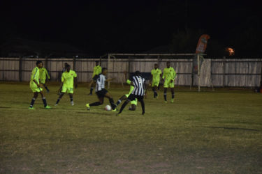 Ryan Hackett (3rd from right) of Santos successfully completes a tackle against a Botofago player in their U19 matchup in the Fruta Conquerors Academy League at the Tucville ground.