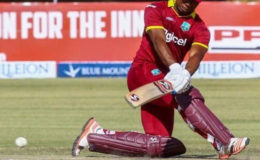 Evin Lewis sweeps during his innings of 148 (photo courtesy of WICB media)