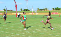 Major upset! Deshanya Skeete of District 10 powering across the line in the girls u-16 200m final to relegate overwhelming favourite, Kenisha Phillips who lost her form and faded badly on the homestretch. (Orlando Charles photo)

