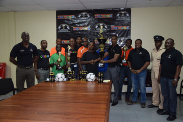 Representatives from participating teams at the launch of the 7th edition of the Guinness Greatest in the Streets football tournament yesterday, along with Lee Baptiste, Guinness brand manager (extreme left), Carena Damon of Colours Boutique (5th from left), Mark Carrega , Up Like 7 team member, shaking hands with Ian Charles , Guinness Rep.(centre), Troy Mendonca, Petra (3rd from right), and Troy Peters, Banks DIH Communications Officer,(extreme right). 