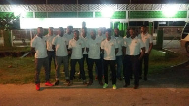 Jamaica bound-The Guyana Senior Basketball Team pose for a photo opportunity in front of the Cliff Anderson Sports Hall prior to their departure for Jamaica to compete in Tri-Nation Invitational Series