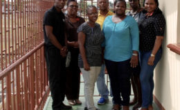 Winston Martindale (left), Director of Child Care and Protection, Ann Greene (second, left), and Brian Backer (fourth, left) with administrators of the Juvenile Detention Facility at Sophia
