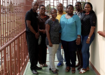 Winston Martindale (left), Director of Child Care and Protection, Ann Greene (second, left), and Brian Backer (fourth, left) with administrators of the Juvenile Detention Facility at Sophia