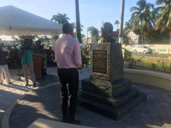 Deputy Mayor Sherod Duncan placing a wreath at the bust on Saturday. 