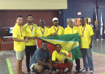 Guyana’s weight lifting outfit pose for a photo with the Golden Arrowhead at the Barbados Independence Invitational.  