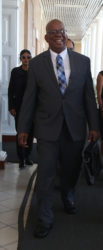 Finance Minister Winston Jordan arrives at the Public Buildings for yesterday’s budget presentation. (Photo by Keno George)