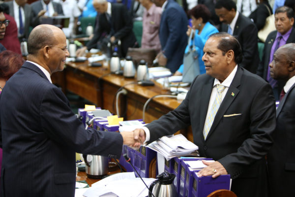 Cordial relations: Prime Minister Moses Nagamootoo (right) and PPP General Secretary Clement Rohee greeting each other at Parliament yesterday. (Photo by Keno George)