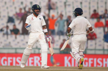 India’s Virat Kohli and Parthiv Patel (R) celebrate after winning the match at the Punjab Cricket Association Stadium, Mohali, India (REUTERS/Adnan Abidi)