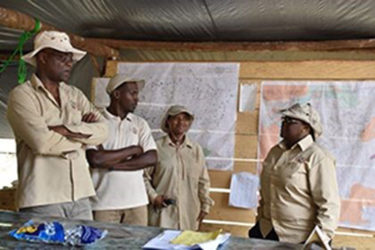 Minister within the Ministry of Natural Resources, Simona Broomes (right) interacting with Guyana Geology and Mines Commission’s field officers (GINA photo) 