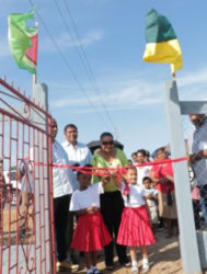 Minister of Social Protection Volda Lawrence, along with two girls cutting the ribbon to open the recreational park in Rose Hall Town, Berbice (GINA photo) 