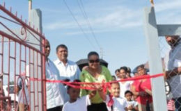 Minister of Social Protection Volda Lawrence, along with two girls cutting the ribbon to open the recreational park in Rose Hall Town, Berbice (GINA photo)

