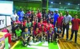 Representatives of the Guyana Table Tennis Association (GTTA) and the Titans Table Tennis Club pose with the top players of the respective categories.